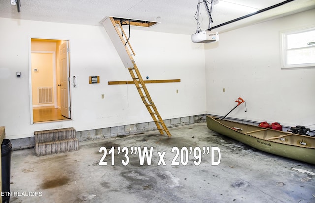 247 Lakeview Dr, Crossville, TN 38558 - garage featuring a garage door opener