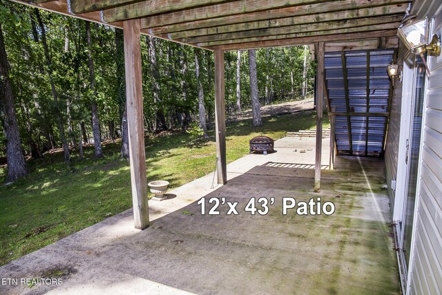 247 Lakeview Dr, Crossville, TN 38558 - view of patio featuring a fire pit and a pergola