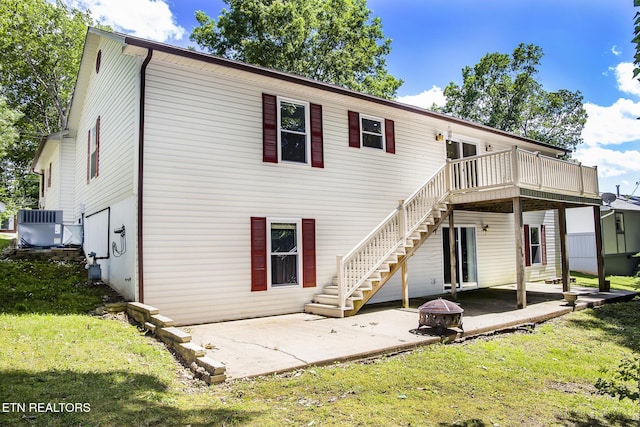 247 Lakeview Dr, Crossville, TN 38558 - rear view of property with an outdoor fire pit, central air condition unit, a lawn, stairway, and a wooden deck