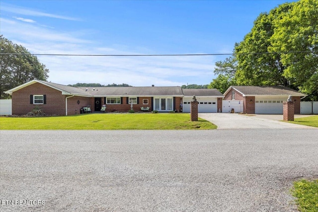 5912 New Beaver Creek Dr, Knoxville, TN 37931 - ranch-style home featuring concrete driveway, an attached garage, and brick siding