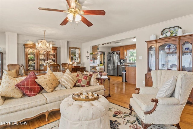 5912 New Beaver Creek Dr, Knoxville, TN 37931 - living room with light wood finished floors, a ceiling fan, and a chandelier
