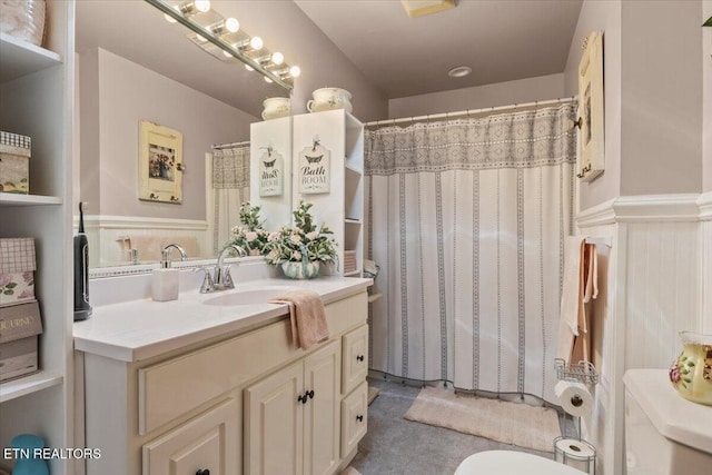 5912 New Beaver Creek Dr, Knoxville, TN 37931 - bathroom featuring toilet, vanity, a shower with shower curtain, and a wainscoted wall