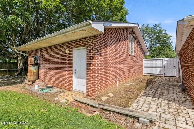 5912 New Beaver Creek Dr, Knoxville, TN 37931 - view of side of home featuring brick siding and a gate