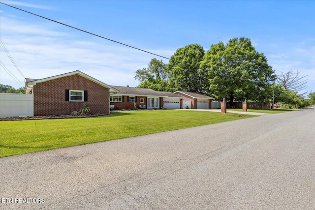 5912 New Beaver Creek Dr, Knoxville, TN 37931 - single story home with an attached garage, brick siding, and concrete driveway