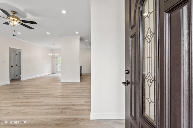 1287 Lori Ellen Ct, Sevierville, TN 37876 - foyer featuring crown molding, a chandelier, ceiling fan, baseboards, and light wood-style floors