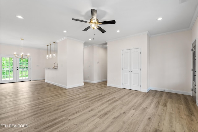 1287 Lori Ellen Ct, Sevierville, TN 37876 - unfurnished living room with ceiling fan, light wood finished floors, a chandelier, ornamental molding, and baseboards