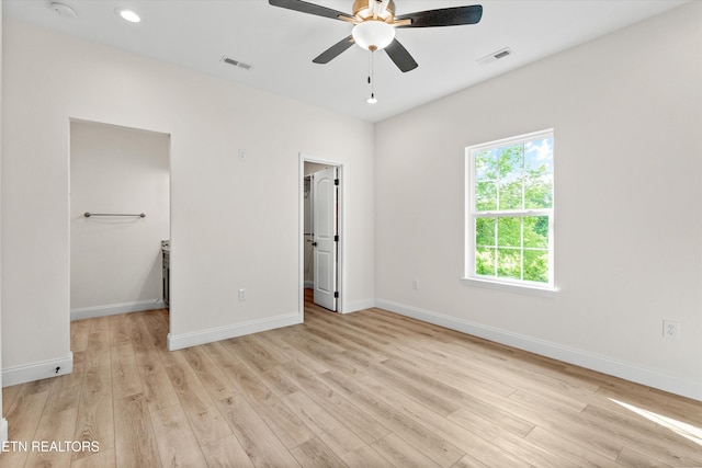 1287 Lori Ellen Ct, Sevierville, TN 37876 - unfurnished bedroom with a spacious closet, light wood-style floors, baseboards, a closet, and recessed lighting