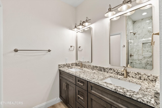 1287 Lori Ellen Ct, Sevierville, TN 37876 - full bath featuring a marble finish shower, double vanity, and baseboards