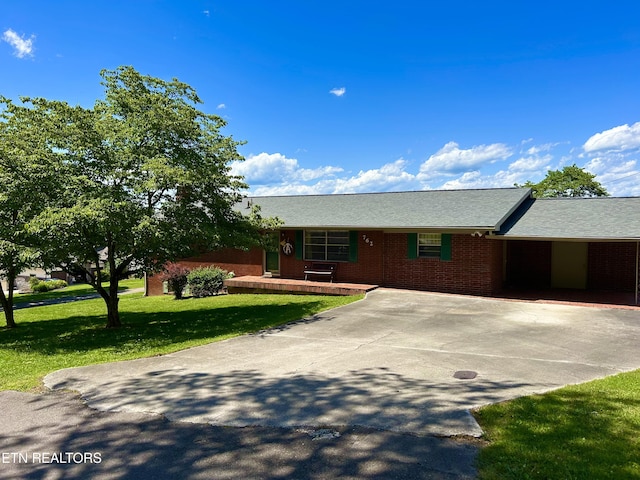 762 Commanche Dr, Jefferson City, TN 37760 - ranch-style home with a front lawn, concrete driveway, and brick siding