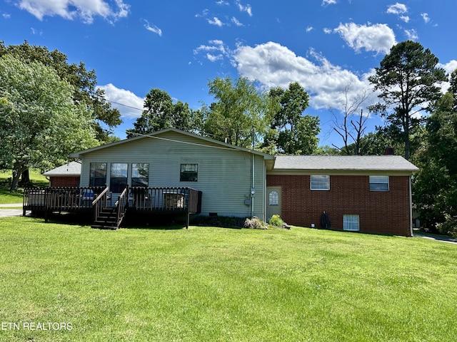 762 Commanche Dr, Jefferson City, TN 37760 - rear view of house with brick siding, a lawn, and a deck