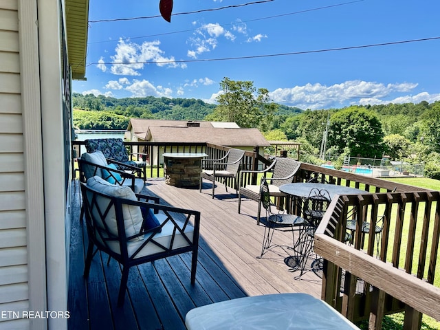 762 Commanche Dr, Jefferson City, TN 37760 - wooden terrace with a forest view and outdoor dining space