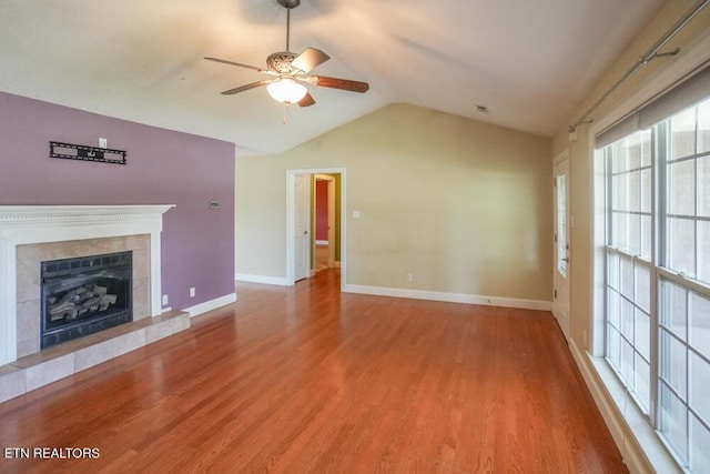 1117 Worthington Blvd, Maryville, TN 37801 - unfurnished living room featuring a ceiling fan, lofted ceiling, wood finished floors, and a tiled fireplace