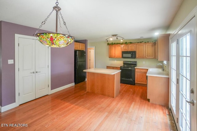 1117 Worthington Blvd, Maryville, TN 37801 - kitchen with black appliances, light countertops, light wood-style floors, and a center island