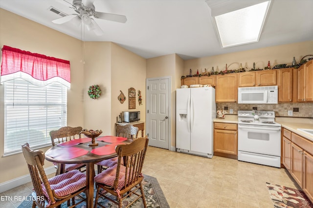 7830 Thomas Henry Way, Knoxville, TN 37938 - kitchen featuring white appliances, light countertops, a ceiling fan, and decorative backsplash