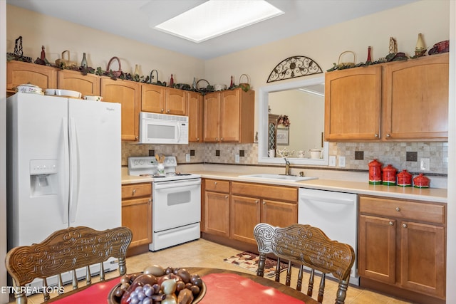 7830 Thomas Henry Way, Knoxville, TN 37938 - kitchen with white appliances, a sink, light countertops, and backsplash