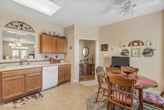7830 Thomas Henry Way, Knoxville, TN 37938 - kitchen with dishwasher, a ceiling fan, light countertops, a sink, and decorative backsplash