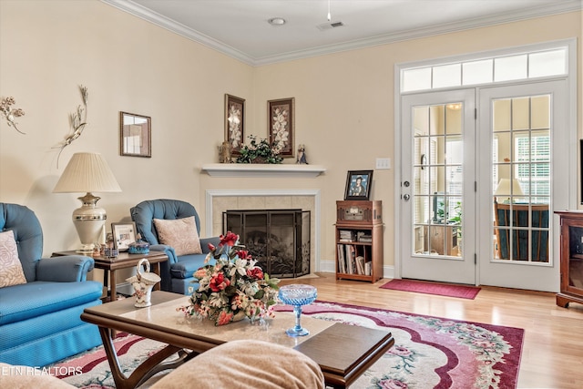 7830 Thomas Henry Way, Knoxville, TN 37938 - living room with a tiled fireplace, wood finished floors, and crown molding
