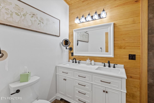 2115 Riverview Dr, Dandridge, TN 37725 - bathroom with wooden walls, double vanity, and toilet