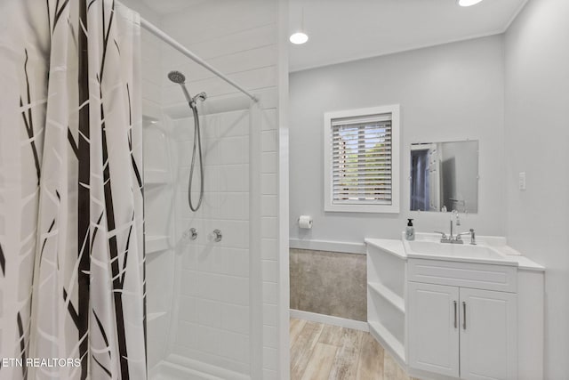 2115 Riverview Dr, Dandridge, TN 37725 - bathroom with a shower with curtain, vanity, wood finished floors, wainscoting, and recessed lighting