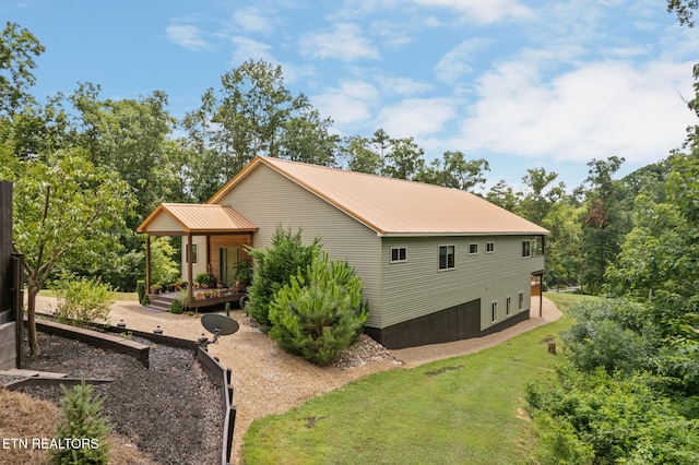 2115 Riverview Dr, Dandridge, TN 37725 - view of home's exterior featuring metal roof and a lawn