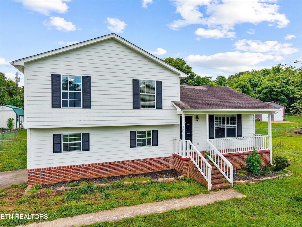 11366 Unitia Rd, Friendsville, TN 37737 - split level home featuring a front lawn, a porch, and a shingled roof