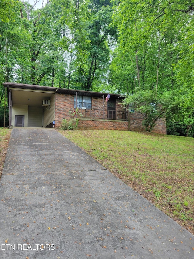 1403 Skyline Dr, New Market, TN 37820 - view of front of property featuring asphalt driveway, a carport, a front lawn, and brick siding