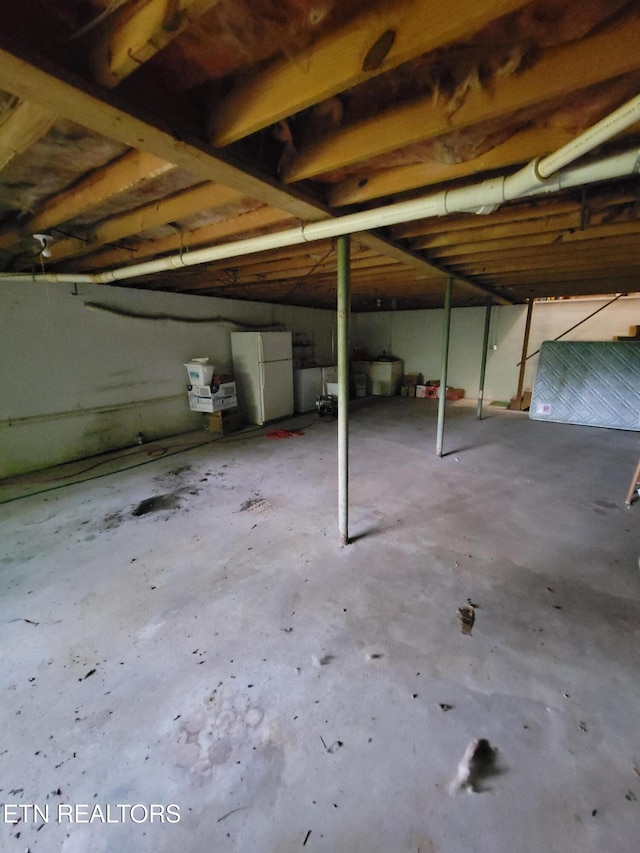 1403 Skyline Dr, New Market, TN 37820 - below grade area featuring freestanding refrigerator