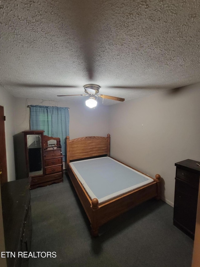 1403 Skyline Dr, New Market, TN 37820 - carpeted bedroom featuring a textured ceiling and ceiling fan