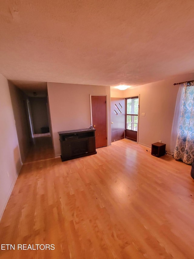 1403 Skyline Dr, New Market, TN 37820 - unfurnished living room with light wood finished floors and baseboards
