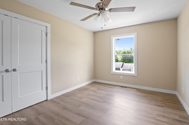 294 Mountain Perkins Ln, Jacksboro, TN 37757 - unfurnished room with wood finished floors, baseboards, and ceiling fan