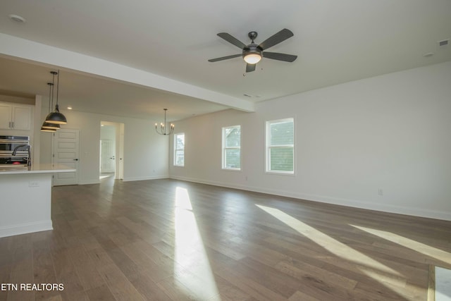 349 Ivey Farms Ln, Farragut, TN 37934 - unfurnished living room featuring a chandelier, ceiling fan, and dark wood-style flooring