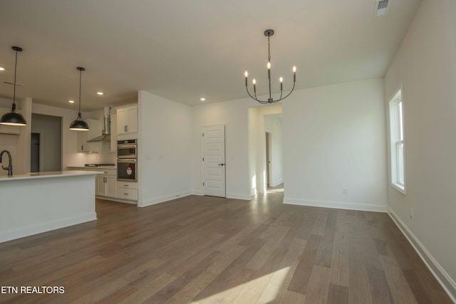 349 Ivey Farms Ln, Farragut, TN 37934 - unfurnished living room featuring a chandelier, dark wood finished floors, and recessed lighting