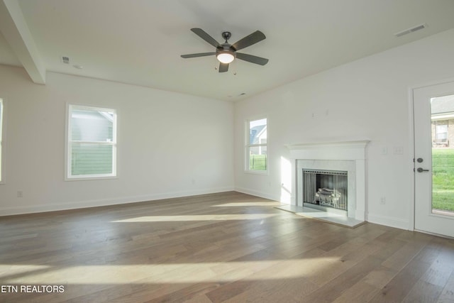 349 Ivey Farms Ln, Farragut, TN 37934 - unfurnished living room featuring wood finished floors, ceiling fan, and a fireplace with raised hearth