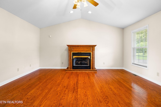 178 Scenic Hill Ln, Lenoir City, TN 37771 - unfurnished living room featuring ceiling fan, a glass covered fireplace, wood finished floors, baseboards, and recessed lighting