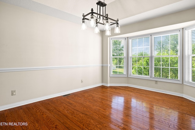 178 Scenic Hill Ln, Lenoir City, TN 37771 - spare room featuring a chandelier, hardwood / wood-style floors, and baseboards