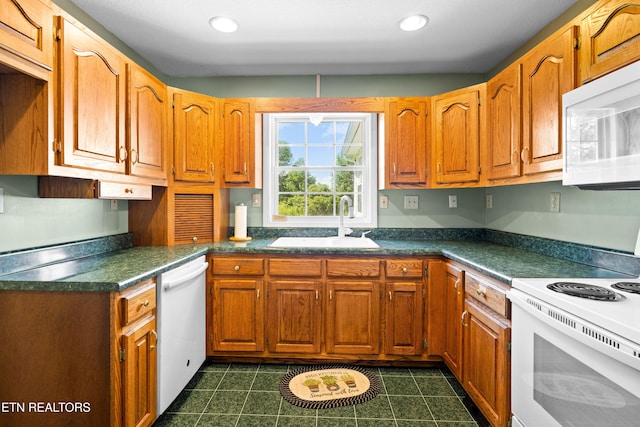 178 Scenic Hill Ln, Lenoir City, TN 37771 - kitchen with white appliances, a sink, dark countertops, brown cabinets, and recessed lighting