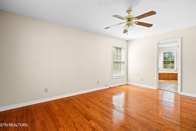 178 Scenic Hill Ln, Lenoir City, TN 37771 - empty room featuring plenty of natural light, light wood-style flooring, baseboards, and ceiling fan