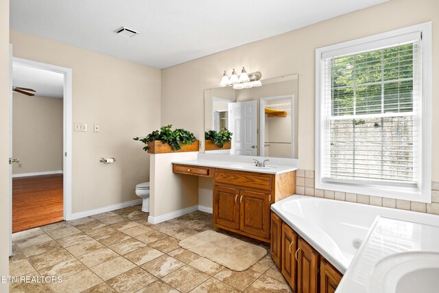 178 Scenic Hill Ln, Lenoir City, TN 37771 - full bathroom featuring a bath, vanity, plenty of natural light, and baseboards