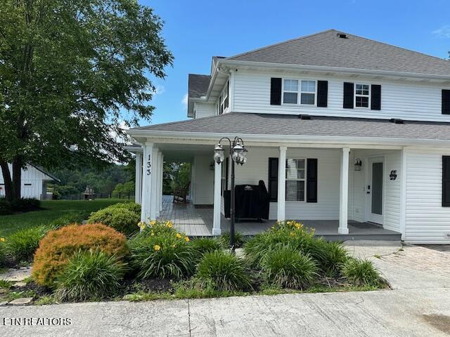 133 Coolidge Rd, Lafollette, TN 37766 - farmhouse-style home featuring covered porch and a shingled roof