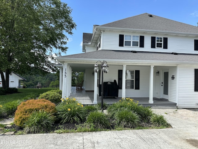 133 Coolidge Rd, Lafollette, TN 37766 - view of front facade with covered porch and a shingled roof