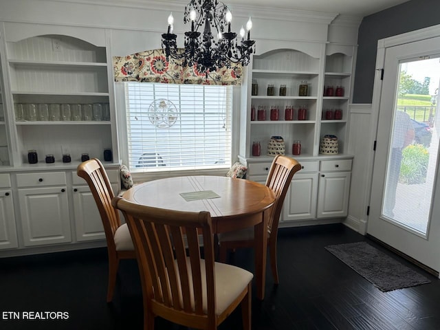 133 Coolidge Rd, Lafollette, TN 37766 - dining room with a chandelier, dark wood-type flooring, crown molding, and built in shelves