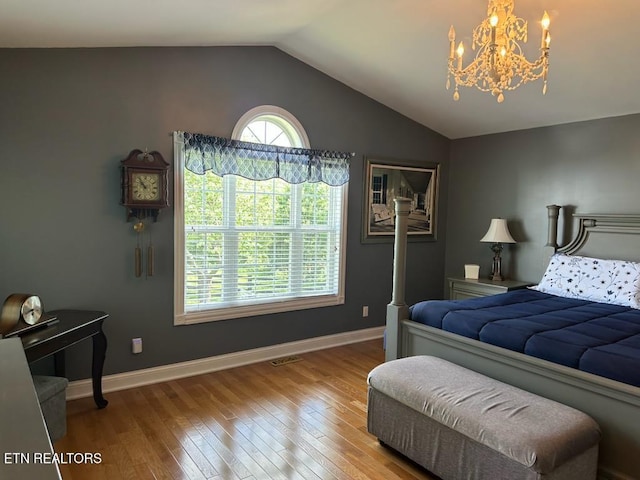 133 Coolidge Rd, Lafollette, TN 37766 - bedroom featuring a chandelier, hardwood / wood-style floors, vaulted ceiling, and baseboards