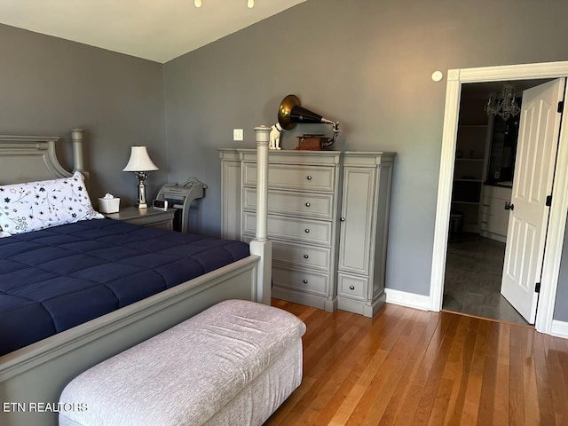 133 Coolidge Rd, Lafollette, TN 37766 - bedroom with wood finished floors, baseboards, and a chandelier