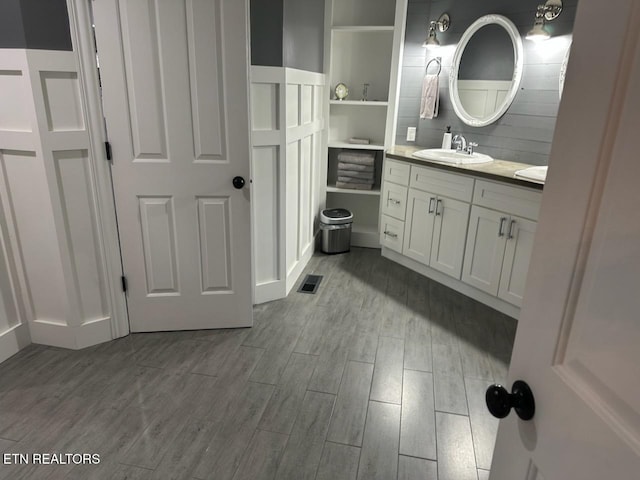 133 Coolidge Rd, Lafollette, TN 37766 - bathroom featuring wood finished floors and vanity