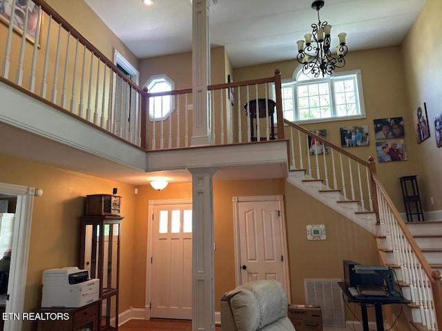 133 Coolidge Rd, Lafollette, TN 37766 - stairs with ornate columns, a towering ceiling, a chandelier, baseboards, and recessed lighting