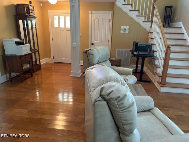 133 Coolidge Rd, Lafollette, TN 37766 - living area featuring baseboards, wood-type flooring, and stairway