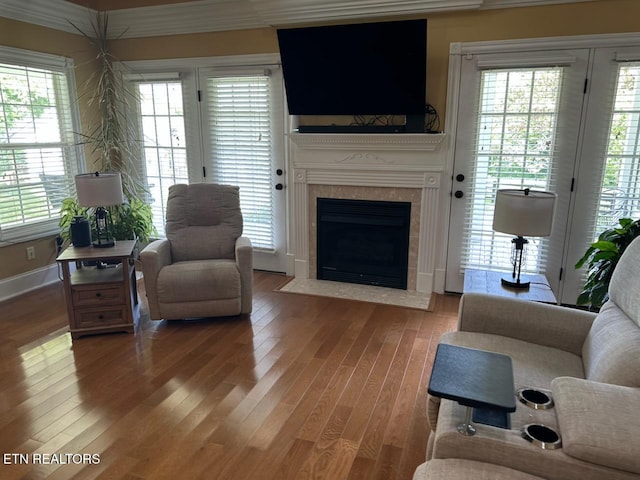 133 Coolidge Rd, Lafollette, TN 37766 - living area featuring light wood-type flooring, a tiled fireplace, and baseboards