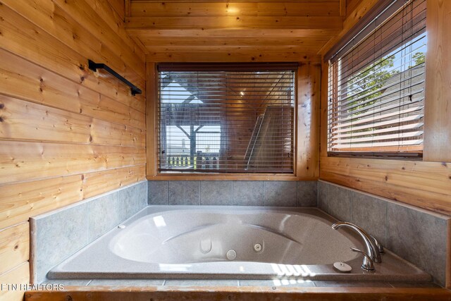 2819 White Oak Ridge Ln, Sevierville, TN 37862 - full bath featuring a tub with jets, wooden walls, and wooden ceiling