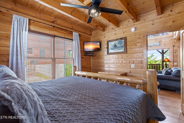 2819 White Oak Ridge Ln, Sevierville, TN 37862 - bedroom with wood finished floors, wooden ceiling with exposed beams, wood walls, and access to exterior