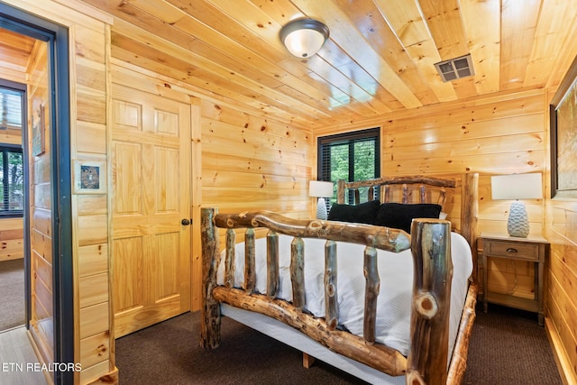 2940 Tower Rd, Sevierville, TN 37876 - bedroom featuring wood walls, carpet flooring, and wood ceiling